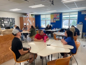 Teachers talking at a table