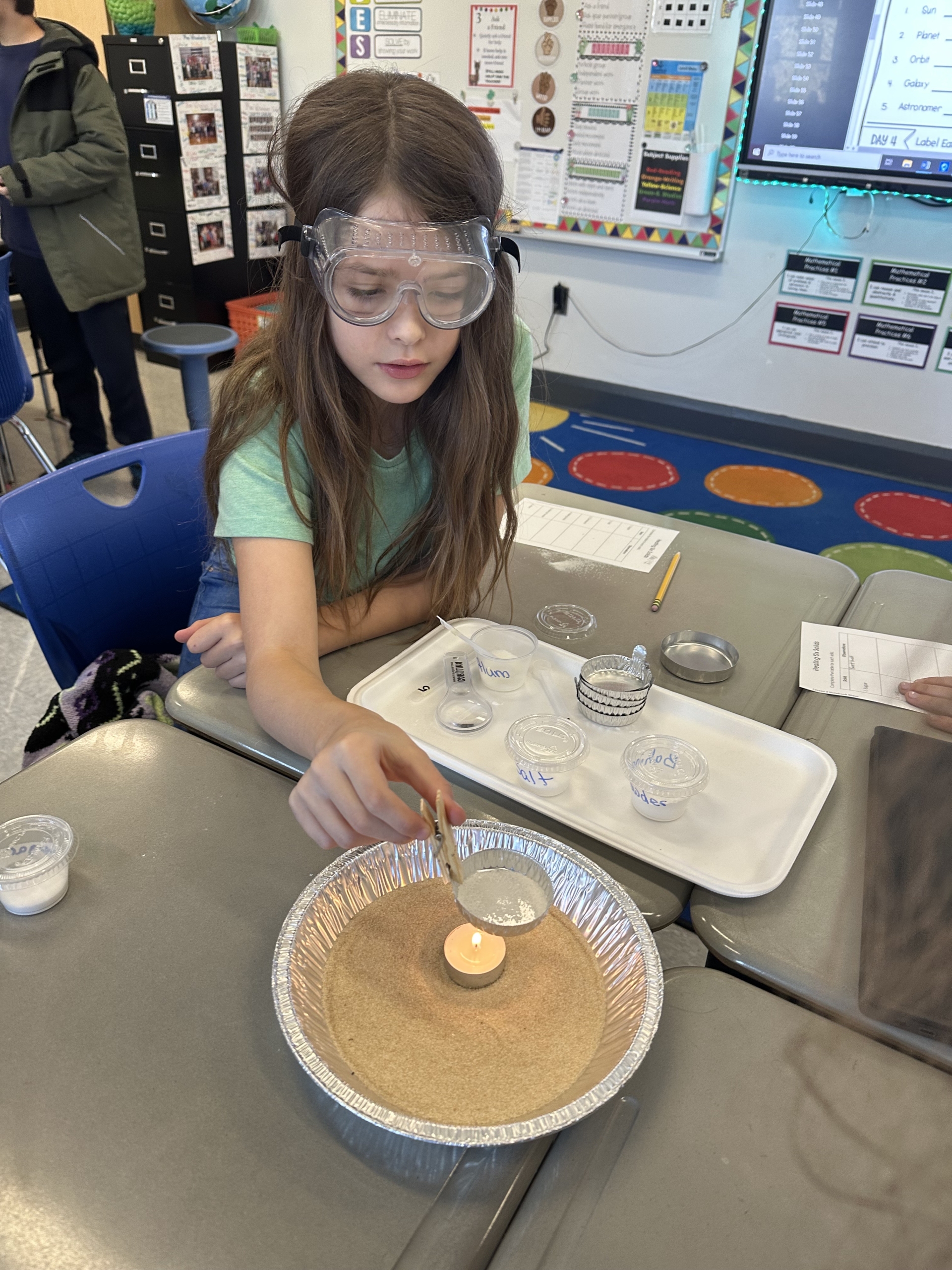 Student participating in science experiment