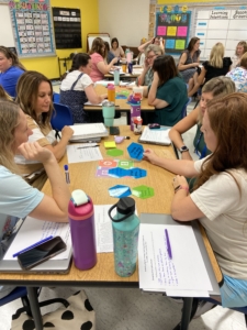 Oldham County Teachers working together at a table