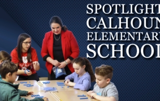 Students at a table use blue math manipulatives as two adults in red shirts support them, with a “Spotlight: Calhoun Elementary School” banner behind them.